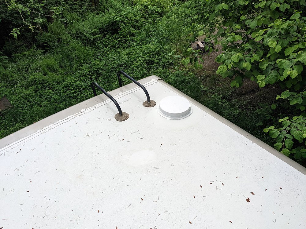 Cell antenna mounted on the roof of an RV.